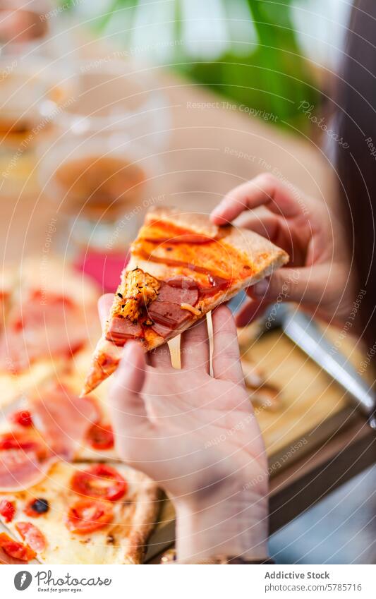 Enjoying a delicious slice of homemade pizza hand cheese tomato sauce melted topping meat savory baked person enjoy meal lunch dinner comfort food cuisine