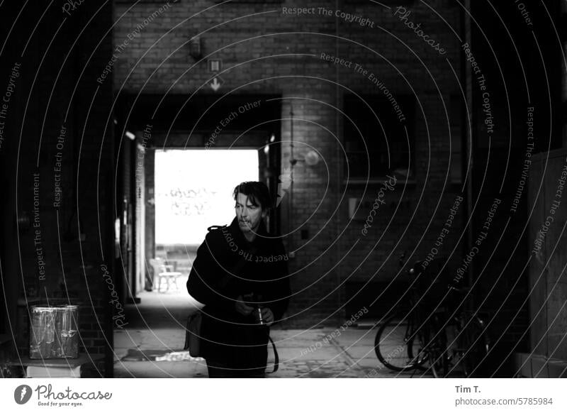 Man in the passageway lars b/w Passage Prenzlauer Berg Berlin Black & white photo Town Exterior shot Capital city Downtown bnw Old town Architecture Day