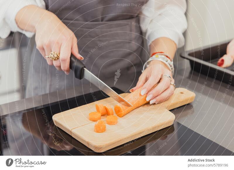 Cooking Roast Chicken with Vegetables in Madrid kitchen cooking preparing food roast chicken vegetables slicing carrots madrid home culinary cuisine person