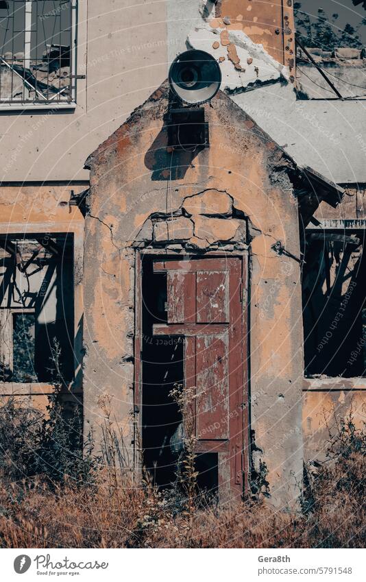 old broken wooden door of a destroyed house in Ukraine access architecture background brown building buried city close color conflict design dirty door handle