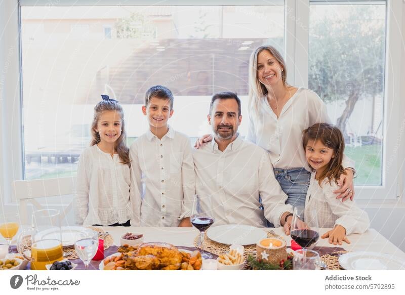 Joyful family enjoying a Christmas meal together christmas home dinner table joyful festive smiling gathering togetherness celebration holiday tradition