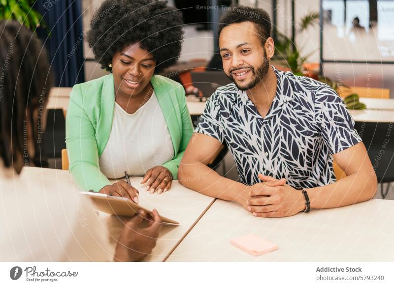 Diverse professionals collaborating in coworking area team discussion modern space diverse business meeting office collaboration coworker productivity