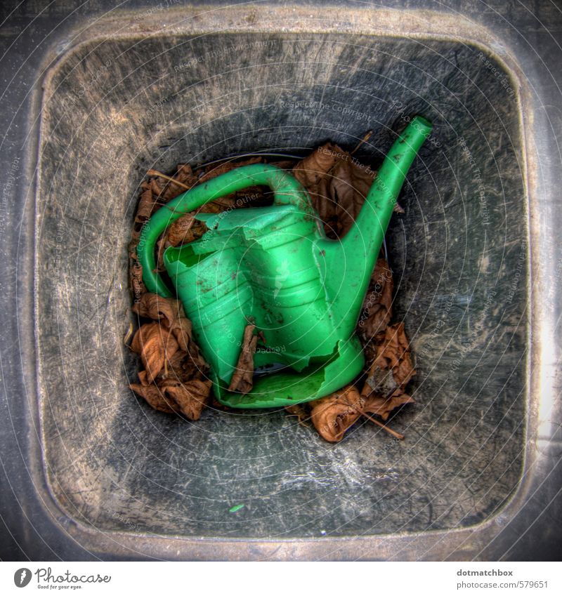 Rejected Garden Leaf Watering can Plastic Old Dirty Broken Gray Green Black Trade Decline Transience Destruction Colour photo Exterior shot Close-up Deserted