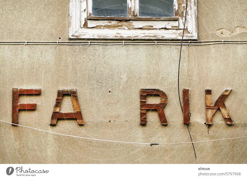 dilapidated letters FA RIK on a building Factory factory building forsake sb./sth. Closed lost place Window Cables Broken incomplete Change Past Ravages of time