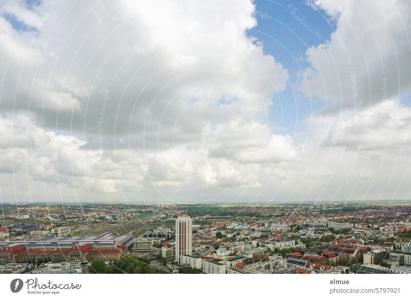 A bird's eye view of the trade fair city of Leipzig with a cloudy sky Bird's-eye view from on high city view cityscape High-rise Train station railway terminus