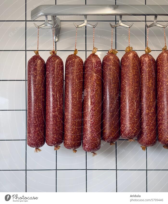 Sausages on a hook sausage Meat Butcher butcher Colour photo Nutrition Trade Animal Swine Eating Killing Farm animal Food Pork Smoked sausages spread Checkmark