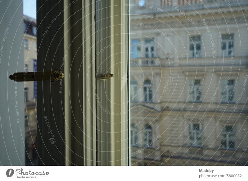 Old wooden frames and windows of a prestigious old apartment opposite an old hotel in the old town of Prague in the Czech Republic Window Old building