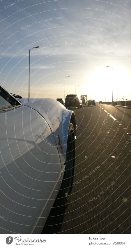 on the road San Francisco California Physics Back-light Dusk Transport Reflection Crane ferrari Car Street freeway Warmth Evening cirrostratus clouds Polished