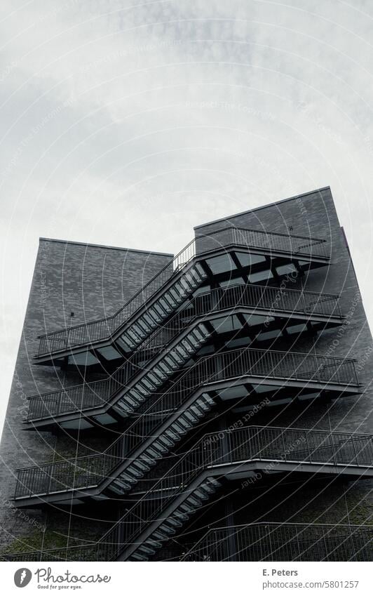 Tall building with a striking staircase on the outside of the house Building Architecture Facade House (Residential Structure) Manmade structures Exterior shot