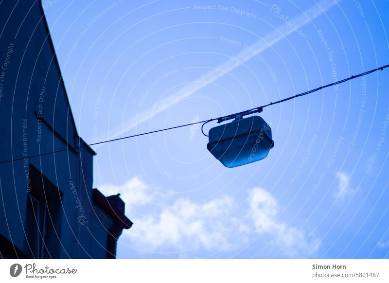 Streetlight in front of a blue sky city view streetlamp daylight Blue sky Street lighting Town Vapor trail cloud Summer in the city Lighting Sky Lamp Cable