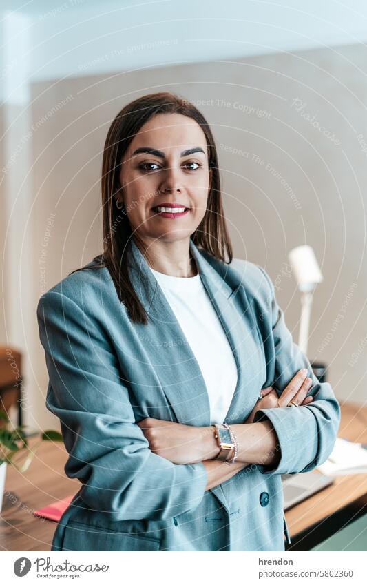 portrait of a businesswoman in the office leader smart proud satisfied aspirations indoor corporate company entrepreneur professional satisfaction work manager