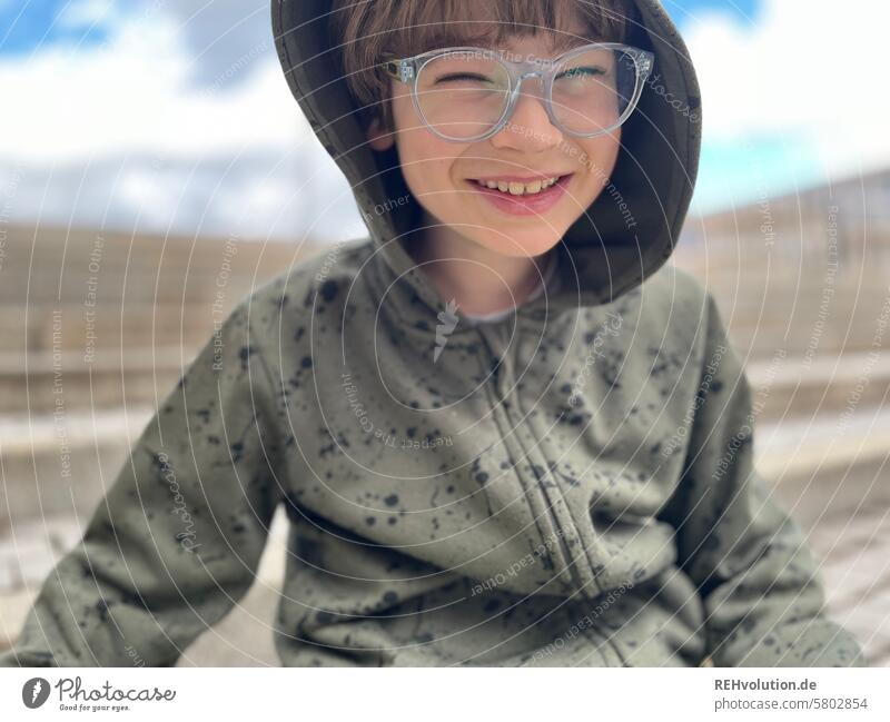 Boy laughs into the camera Child Infancy Boy (child) fortunate Happy portrait Face Looking into the camera bollocks naturally Summer Funny Close-up Upper body