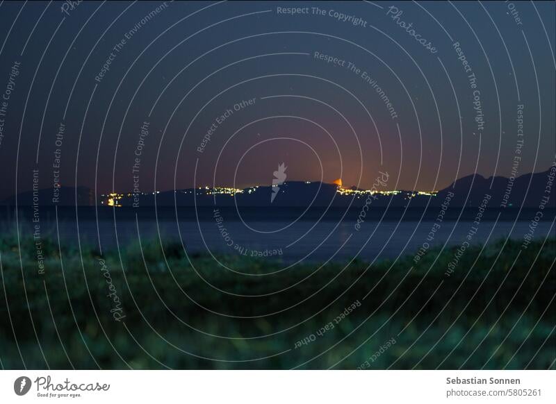 Crescent moon rising over illuminated Amalfi Coast at night, Paestum, Campania, Italy amalfi coastline crescent stars paestum sea twilight europe water campania