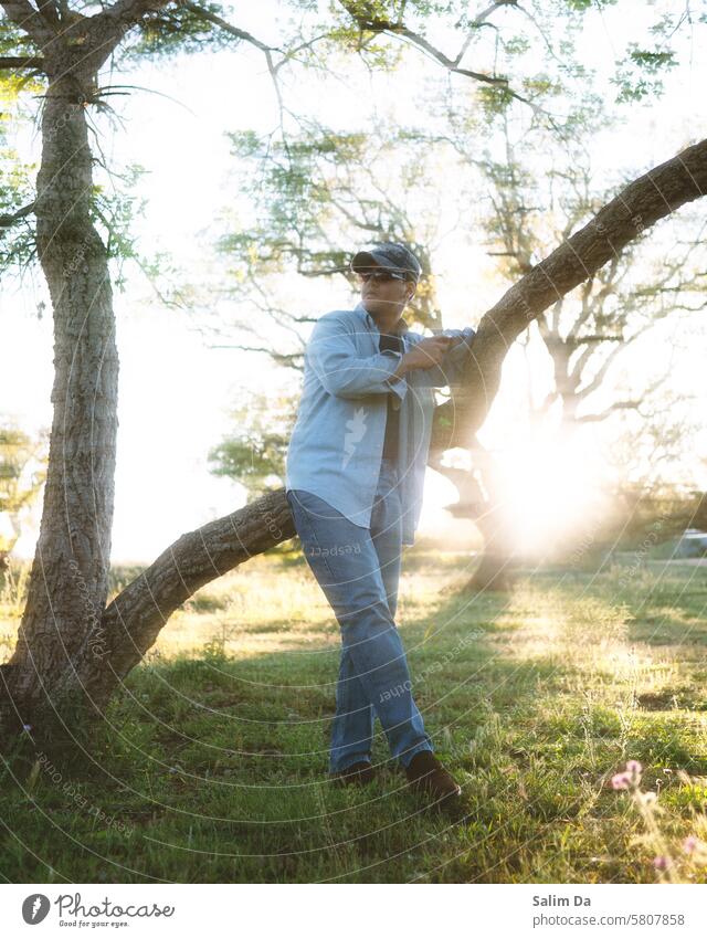 Dreamy artistic glowing outdoor photo of a stylish man dreamy Dreamily Dream world Art Glow Moody outdoors Photography outdoor shot Photos of everyday life