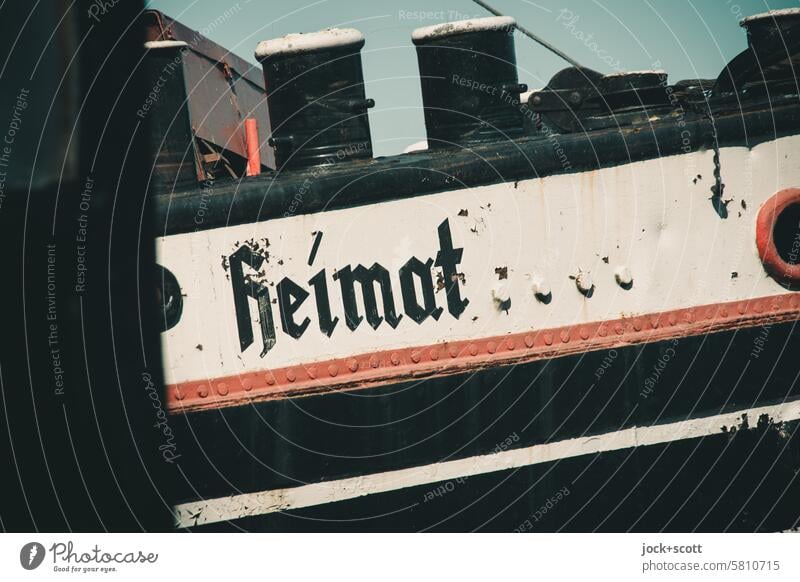 Ship home ship Home country boat Typography old german script Weathered Style Authentic Ship's side Past Ravages of time Nostalgia Historic Word Rust Old