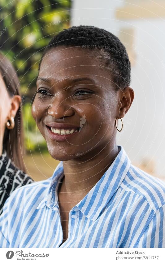 Delighted black woman with short hair looking away smile appearance charming toothy smile cheerful complexion beauty natural female ethnic african american