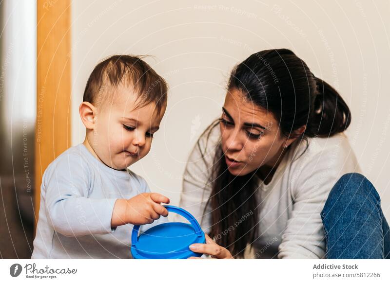 mother playing with her baby son at home child boy family love happy young kid woman cute mom childhood beautiful parent female joy fun motherhood little