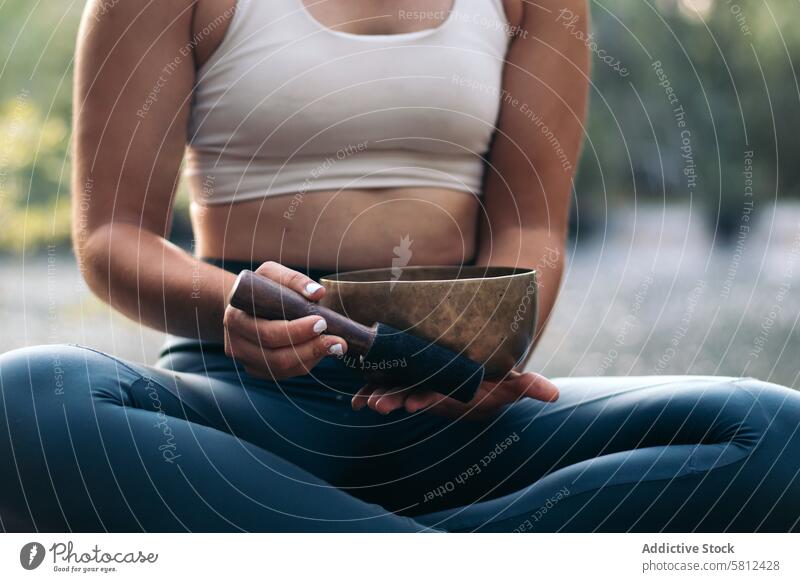 Young woman meditating and doing yoga in nature meditation healthy relaxation body adult pose lifestyle balance exercise young person concentration zen peaceful