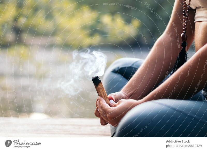 Young woman meditating and doing yoga in nature meditation healthy relaxation body adult pose lifestyle balance exercise young person concentration zen peaceful