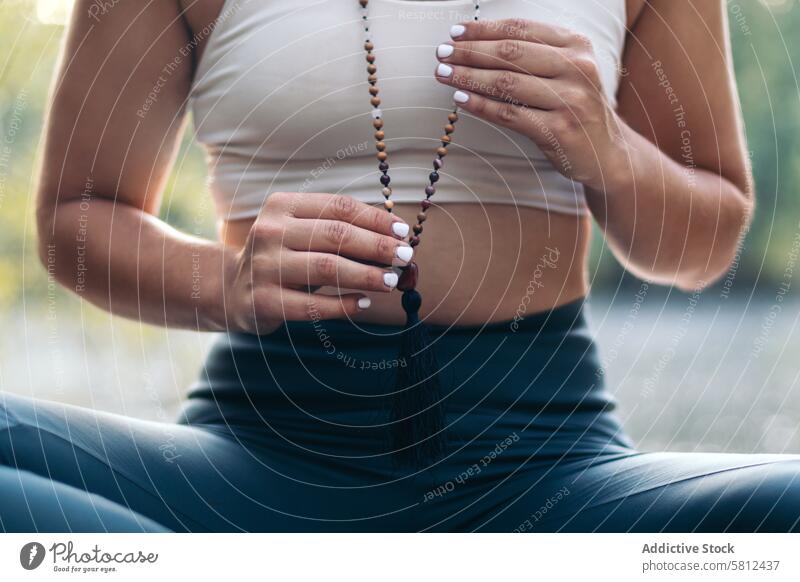 Young woman meditating and doing yoga in nature meditation healthy relaxation body adult pose lifestyle balance exercise young person concentration zen peaceful