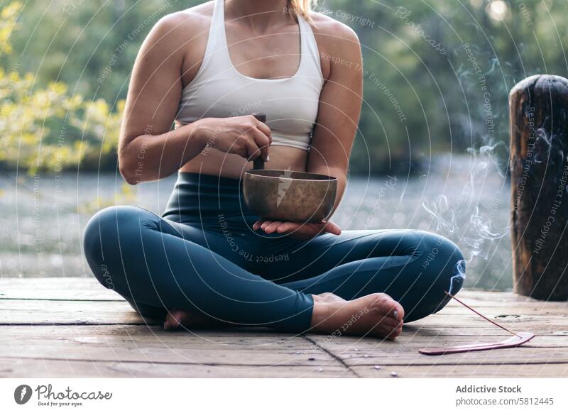 Young woman meditating and doing yoga in nature meditation healthy relaxation body adult pose lifestyle balance exercise young person concentration zen peaceful