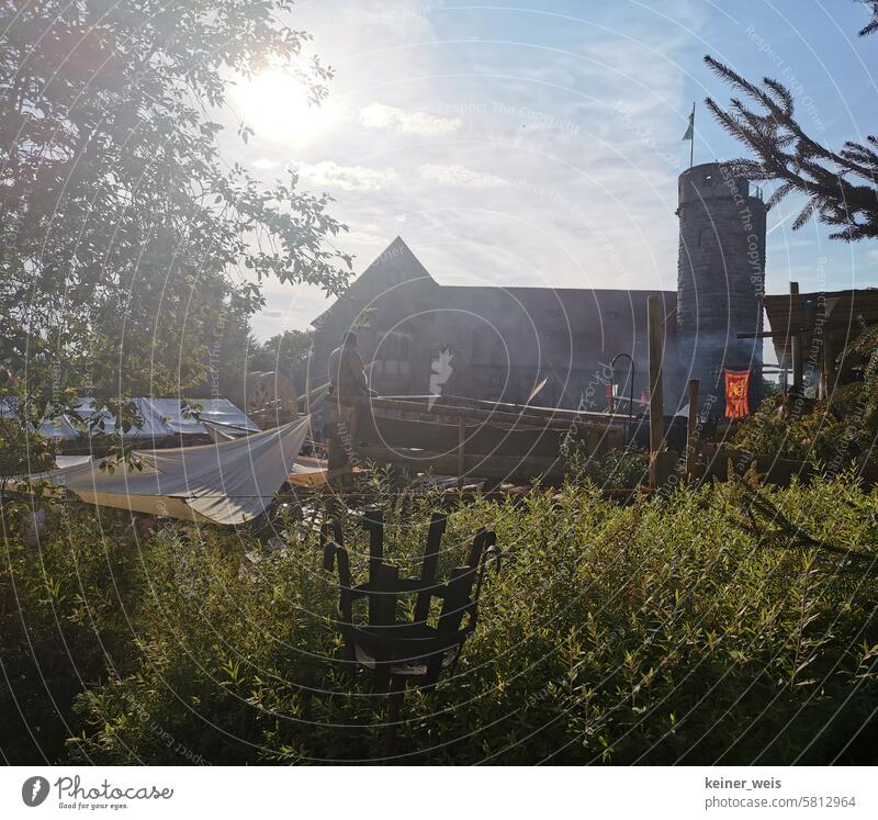 The medieval castle at Cullesheym in Külsheim during the Burgkurzweyl with a man in costume Man Costume Medieval times medieval market Tower Lock Town City hall