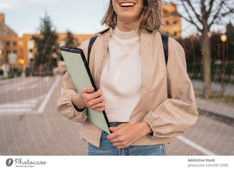 half-portrait of a smiling and beauty student girl. young female woman happy beautiful education smile pretty people cute background school university person