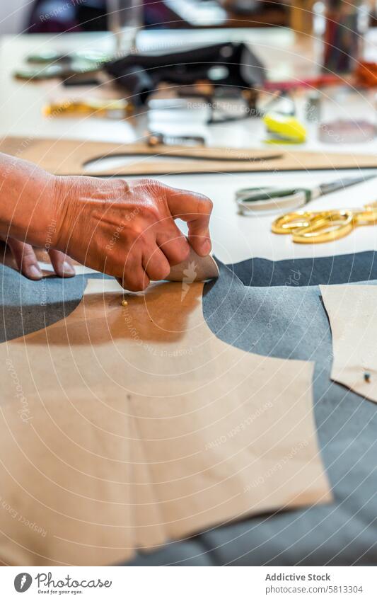 Fashion designer outlining fashion patterns with a tailor's chalk. Vertical shot. 50s Business Person adult businesswoman clothing confidence confident