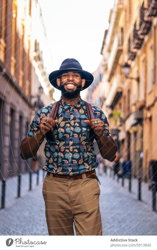 Stylish black man walking on the city street lifestyle young urban male person stylish guy outside people casual outdoors adult fashion summer handsome