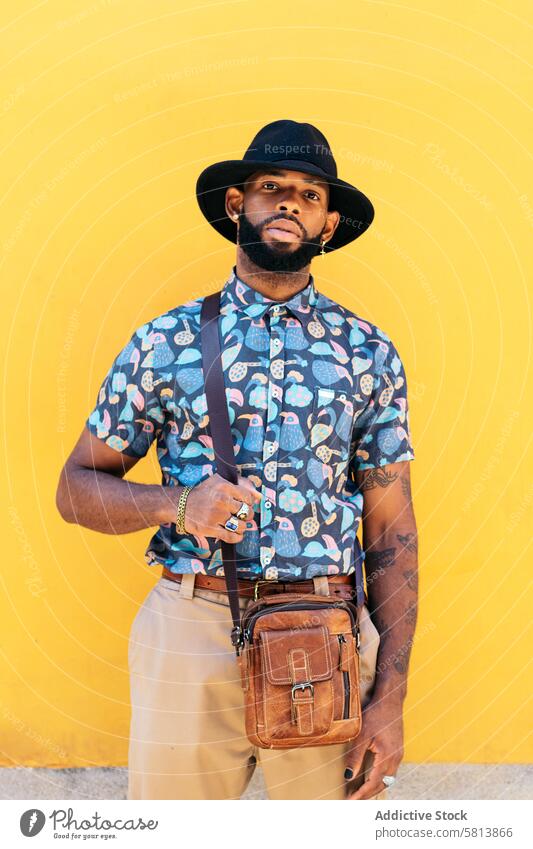 Stylish black man outdoors over yellow background lifestyle city young street urban male person stylish guy outside people casual adult fashion summer handsome