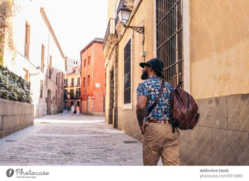 Stylish black man walking on the city street lifestyle young urban male person stylish guy outside people casual outdoors adult fashion summer handsome