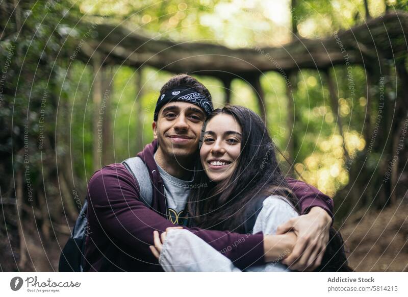 Friends in a jungle in Costa Rica forest portrait outdoors nature lifestyle people vacation leisure looking hiking tree travel backpack autumn adventure closeup