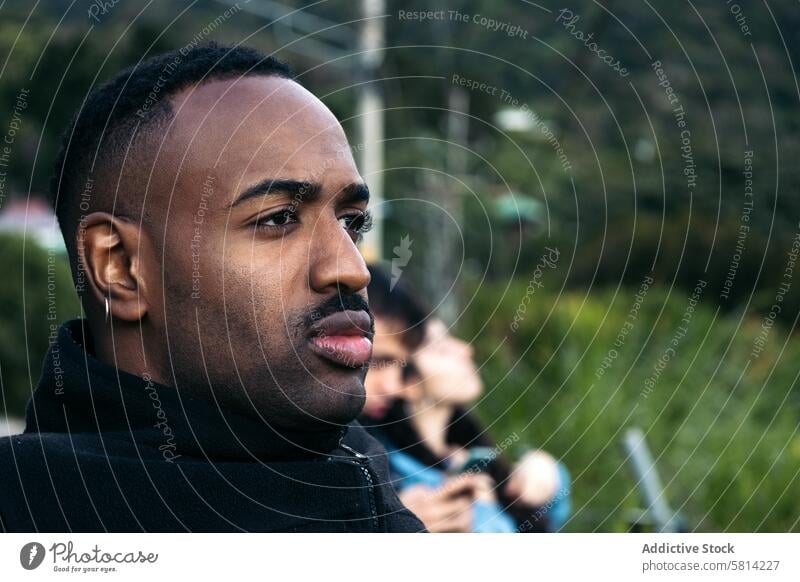 Serious black man in nature landscape travel people outdoor costa rica person background sky watching lifestyle evening scenery destination central america