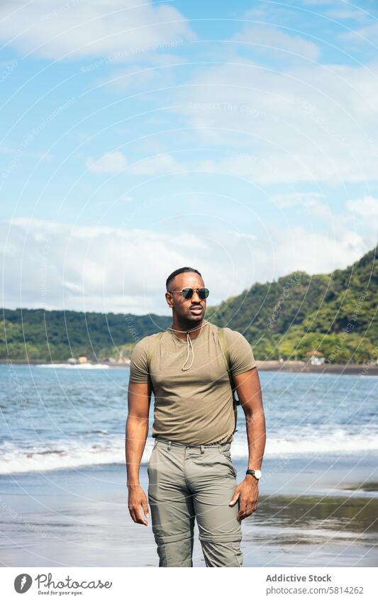 African American man with clothes in the beach black sunglasses male young background guy stylish vacation happy travel portrait lifestyle cool handsome