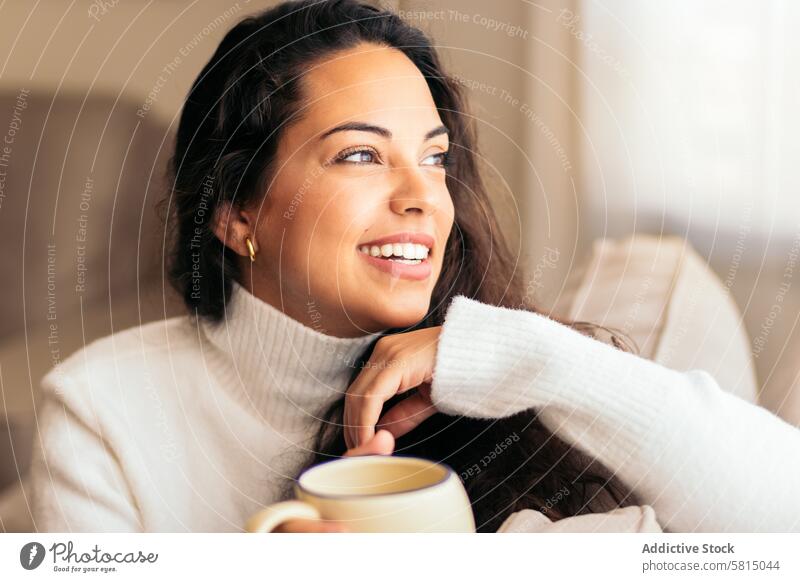 Enjoying Morning at Home: Young Woman Drinking Coffee Relaxation Window Sofa Indoors Cozy Serene Tranquility Comfort Peaceful Lifestyle Contentment Leisure