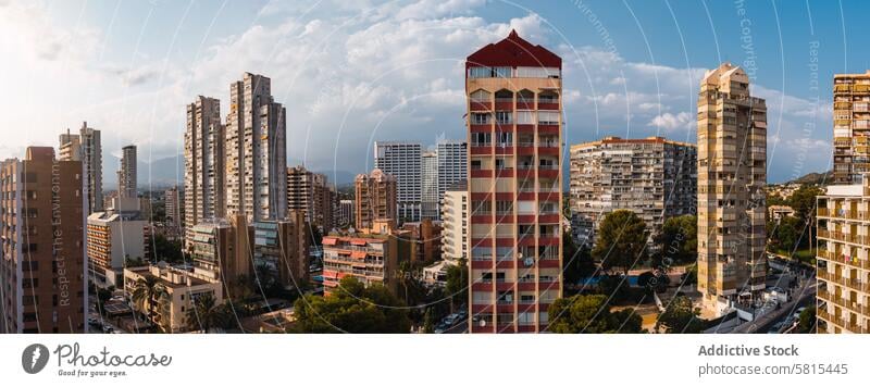 Cityscape against cloudy blue sky cityscape building apartment district modern daytime street area contemporary construction urban structure residential