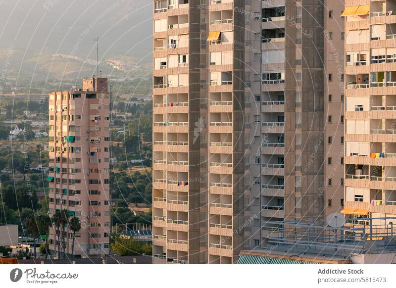 Residential buildings against sunset sky apartment street city modern district architecture urban cityscape twilight dusk sundown construction structure dwell