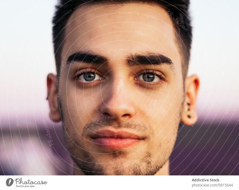 Portrait of a young man in the countryside portrait adult nature person summer caucasian outdoors handsome rural field attractive beard background standing