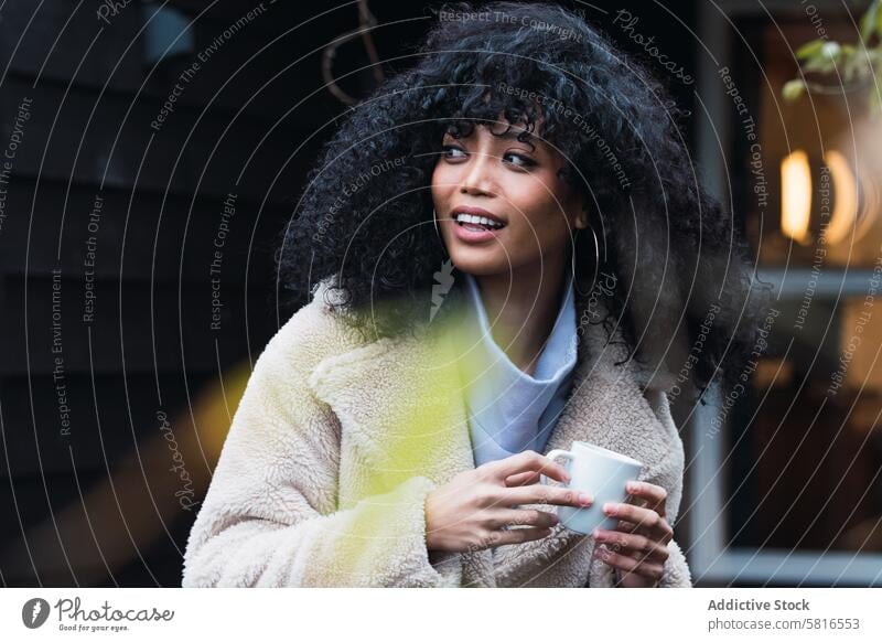 Smiling black woman with cup of coffee drink relax rest house home chill coffee break warm female african american woman mug hot drink positive beverage