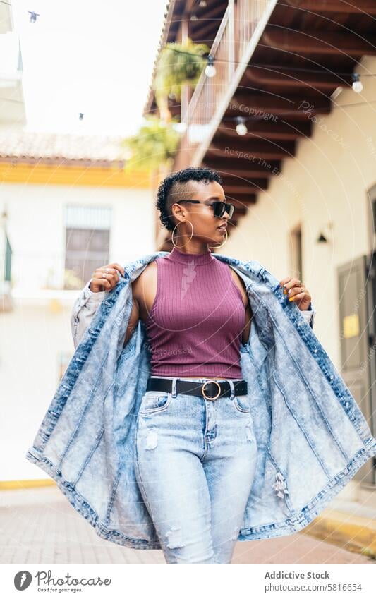 Portrait of a cool Latin American woman in the city happy young summer female outdoors people leisure lifestyle photo joyful adult person looking spring