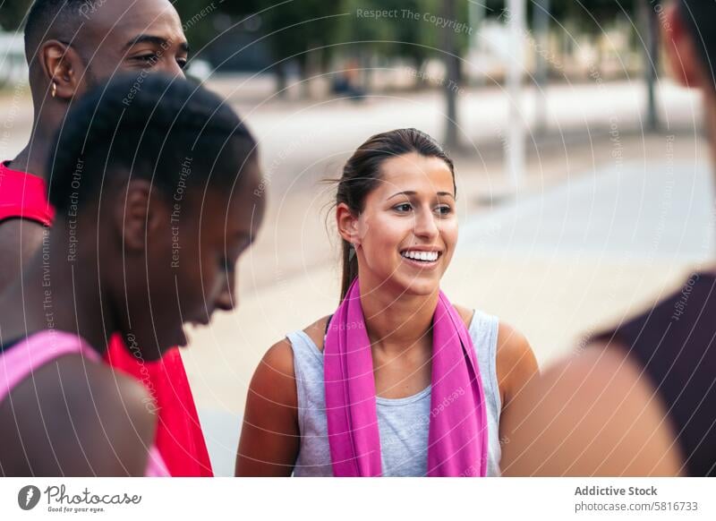 Team Spirit: Multiracial Friends Chatting and Bonding After a Fun Basketball Game friends basketball multiracial sport fun young game court team lifestyle