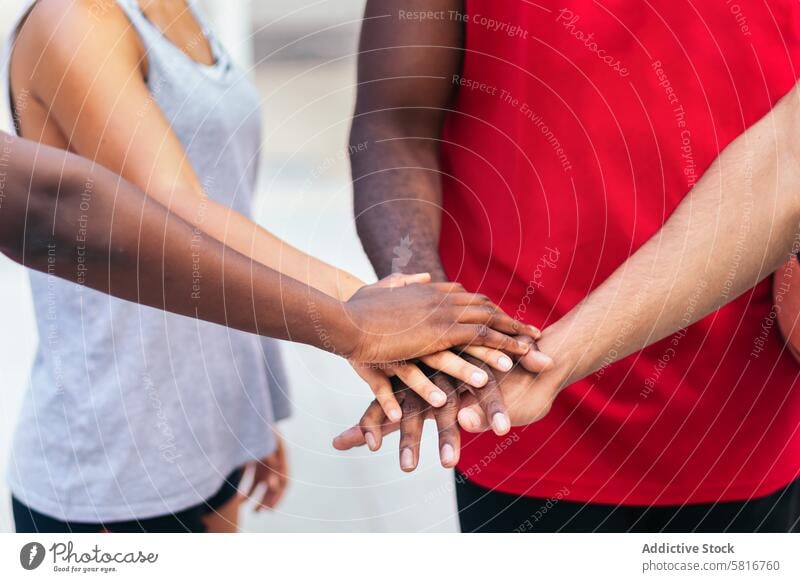 Multiracial team putting hands together before the match friends basketball multiracial sport fun young game court lifestyle player urban training outdoor group