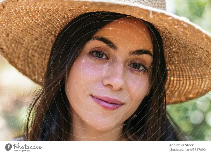 Woman with a straw hat in the forest female young nature park lifestyle walk leisure outdoors sunny tree caucasian holiday happiness green natural travel summer