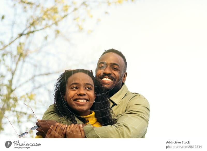 afro american couple smiling and hugging happy cheerful man woman people young love lifestyle together beautiful african relationship boyfriend girlfriend black