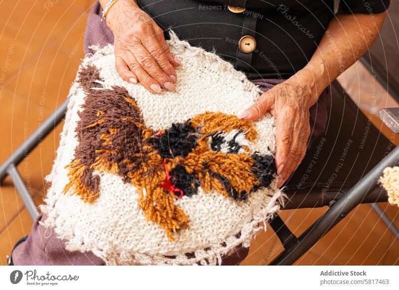 Stitched memories. Elderly woman knits with love. Asian active aging art and craft artistic artistic expression authenticity care cozy home craftsmanship