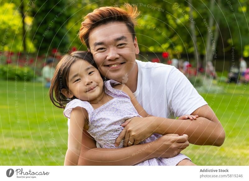 Asian father and daughter enjoying park in Europe asian family vacation europe travel holiday smiling love bonding quality time outdoors nature garden greenery