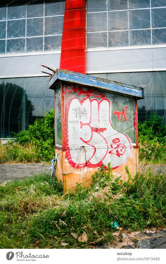 graffiti in abandoned security post parking no people transportation color image gate architecture city parking lot control boundary door garage safety entrance