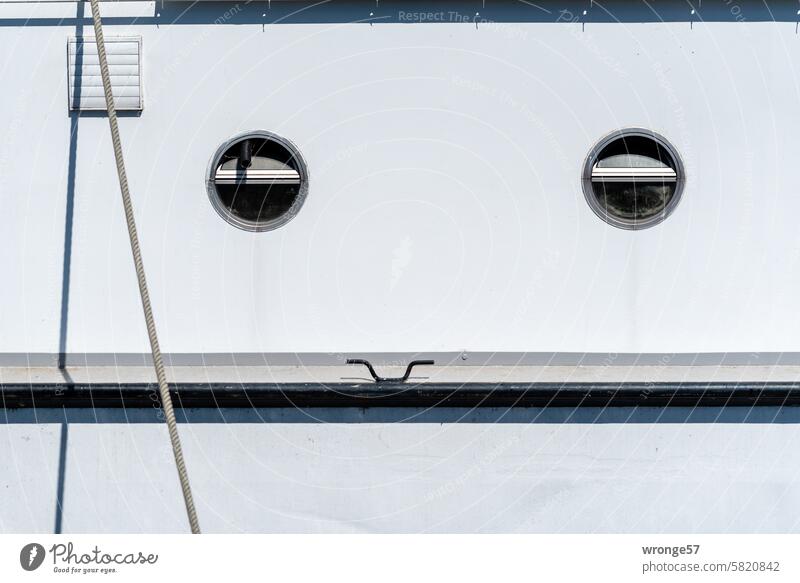 Fun side of a boat ship Ship's side portholes Fastener Comical Watercraft Maritime Harbour Exterior shot Deserted Colour photo Close-up Detail Navigation