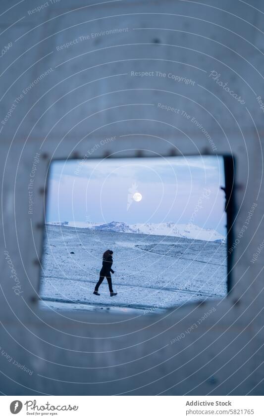 Moonlit walk through Iceland winter landscape iceland snow person moon nature travel cold outdoor scenery adventure solitude framed night moonlight explorer