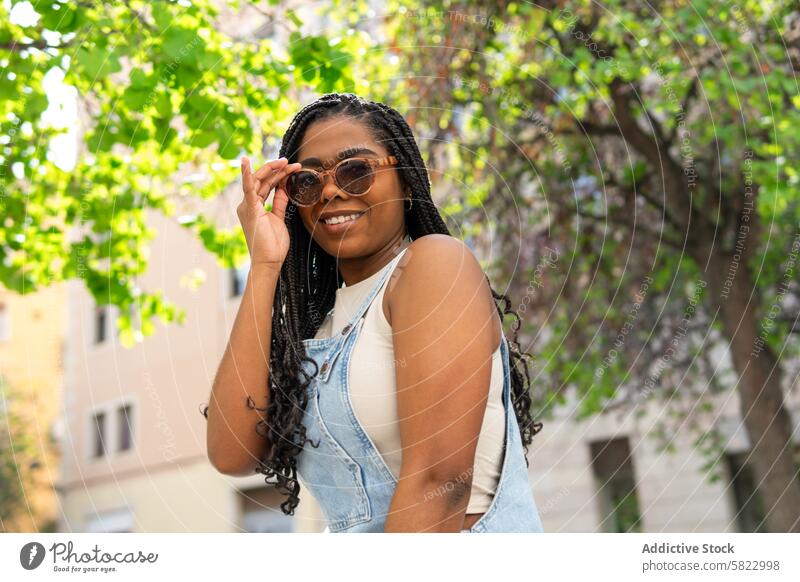 Cheerful Woman Enjoying Summer in Barcelona Streets woman summer barcelona sunglasses smile cheerful happy sunny street greenery carefree young fashion casual